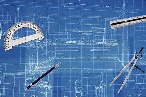 Blueprint on blue background with drawing tools: protractor, ruler, compass, and pen.
